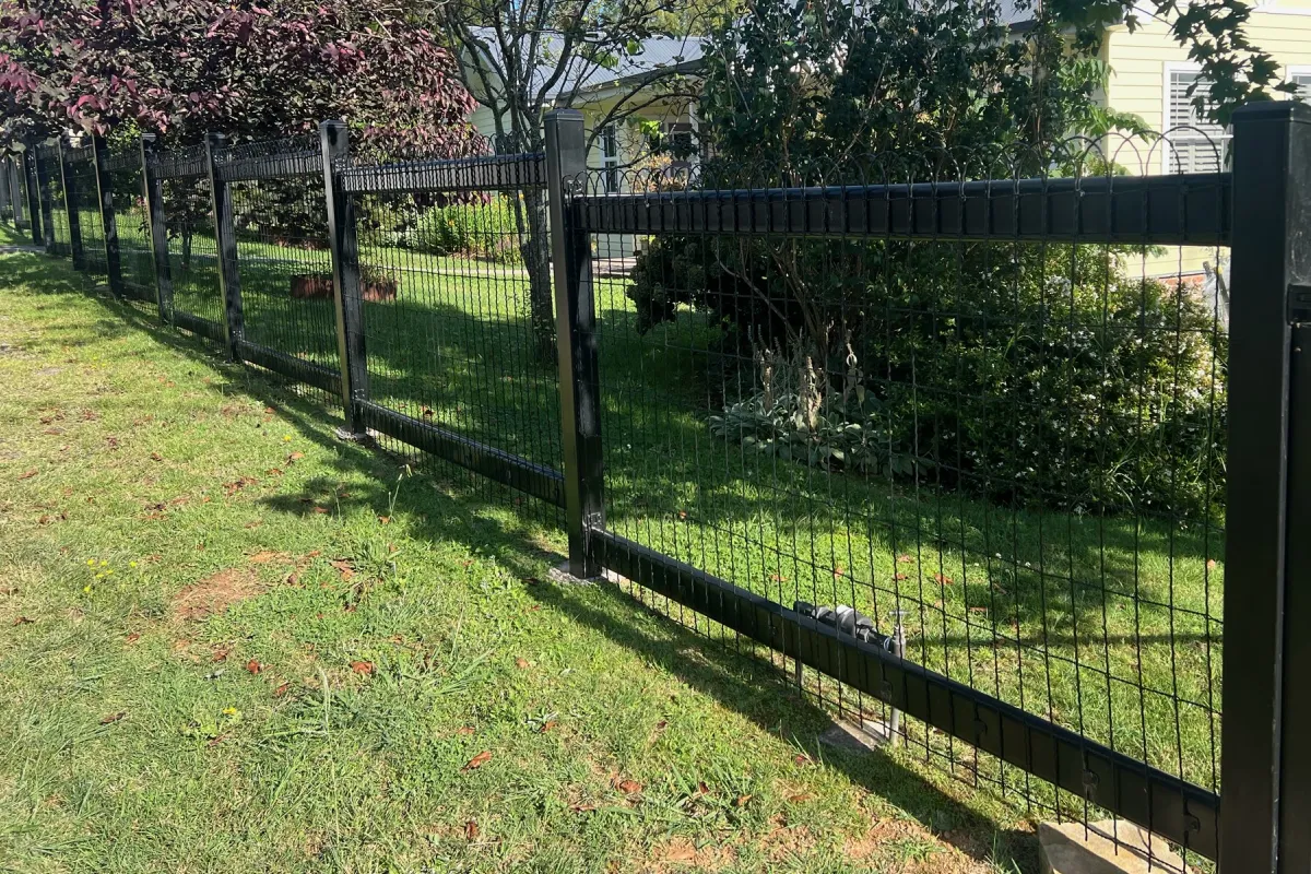 Black steel and woven wire cottage boundary fence