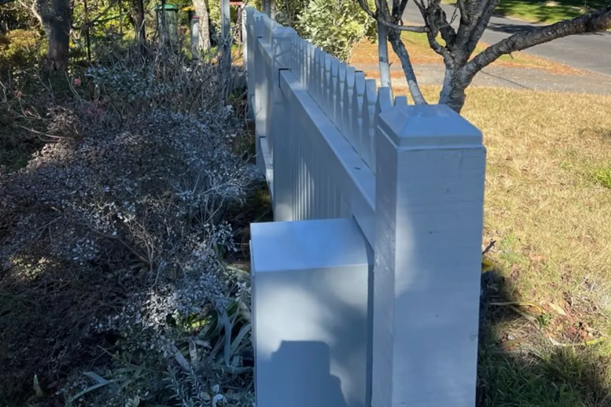 White timber picket fence with integrated mailbox